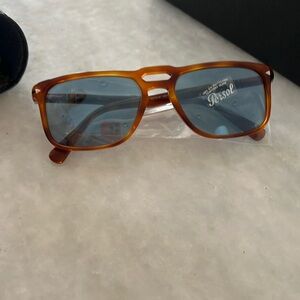 Authentic new in the box Persol sunglasses.